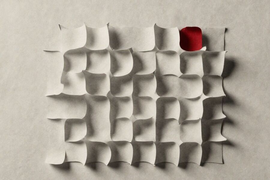 A paper lattice of rounded cells with one filled in solid