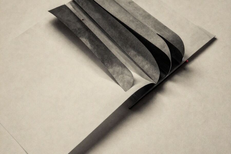 Overlapping paper arcs opened out like a fan